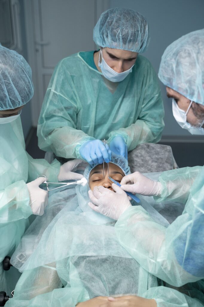 high-angle-doctors-performing-rhinoplasty