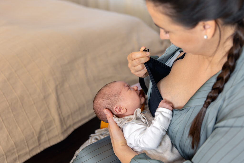 mother-breastfeeds-newborn-baby-motherhood-child-care-concept