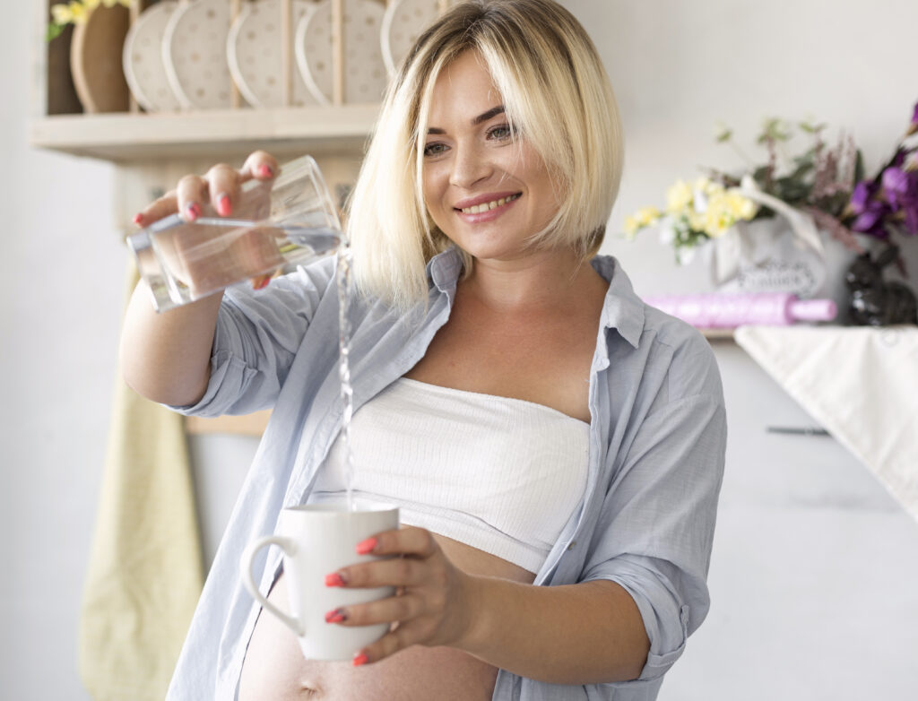 pregnant-woman-pouring-water-glass
