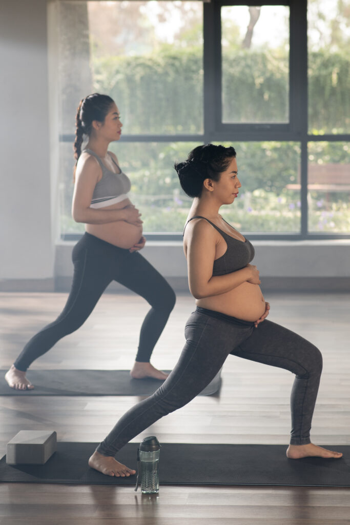 pregnant-women-practicing-yoga-together