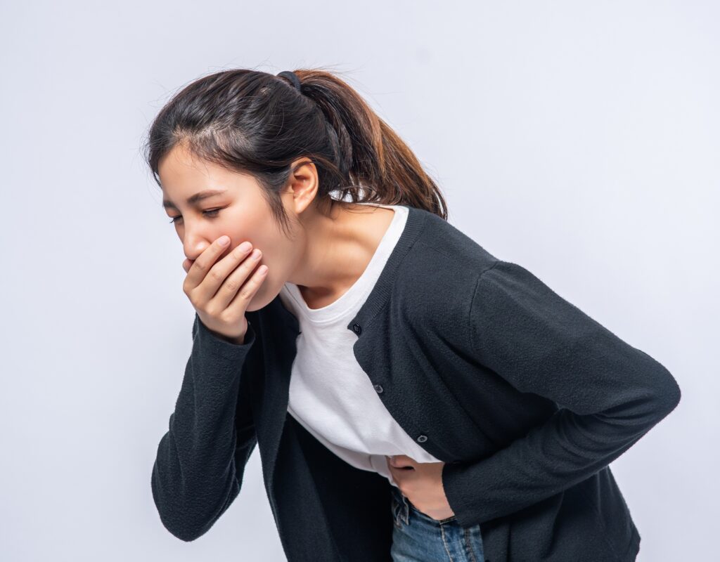 woman-with-stomachache-puts-her-hands-her-stomach-covers-her-mouth